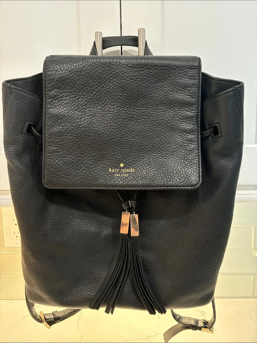 kate spade Black Pebbled Leather Tassel Drawstring Backpack